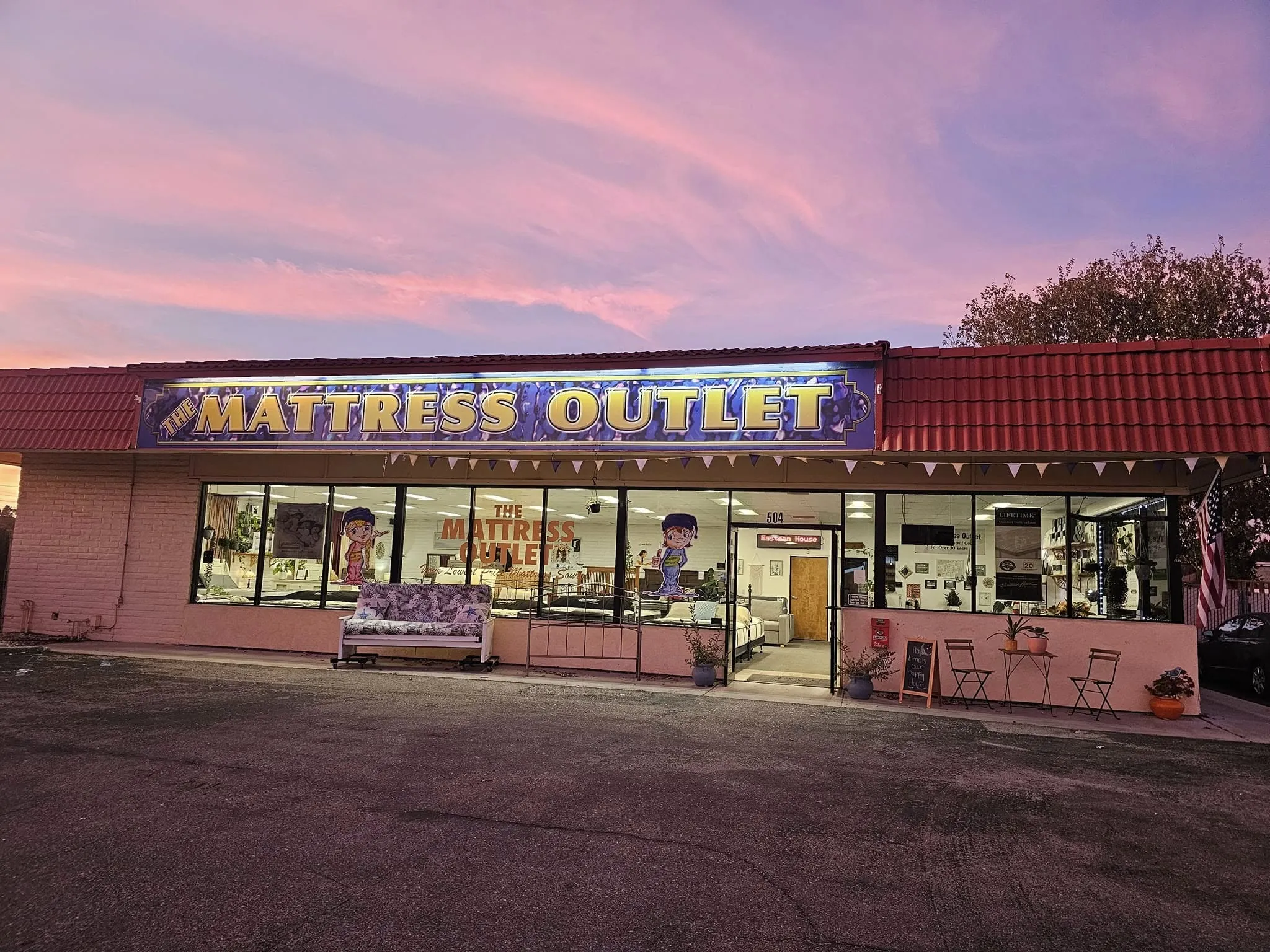 The Mattress Outlet storefront in the evening